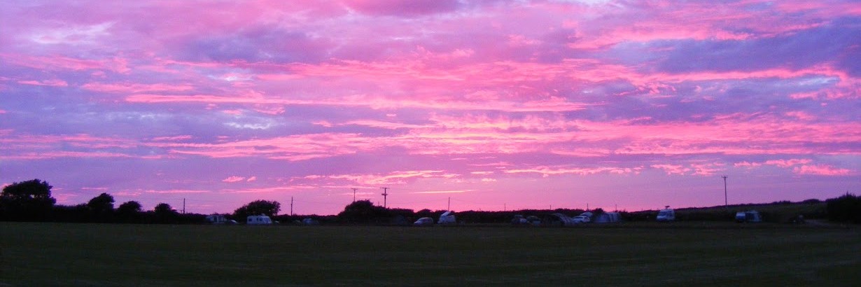 Sunset at Sea View Campsite, Dartmouth, UK. Large pitches and panoramic views from this South Devon camping site near the beach.